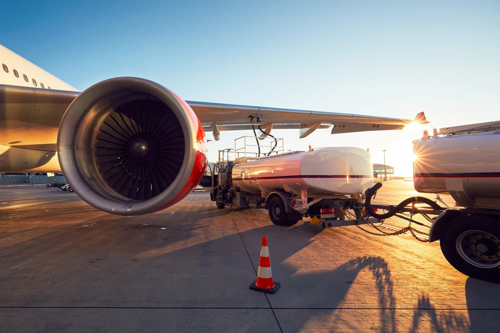 A jet being refueled on the runway